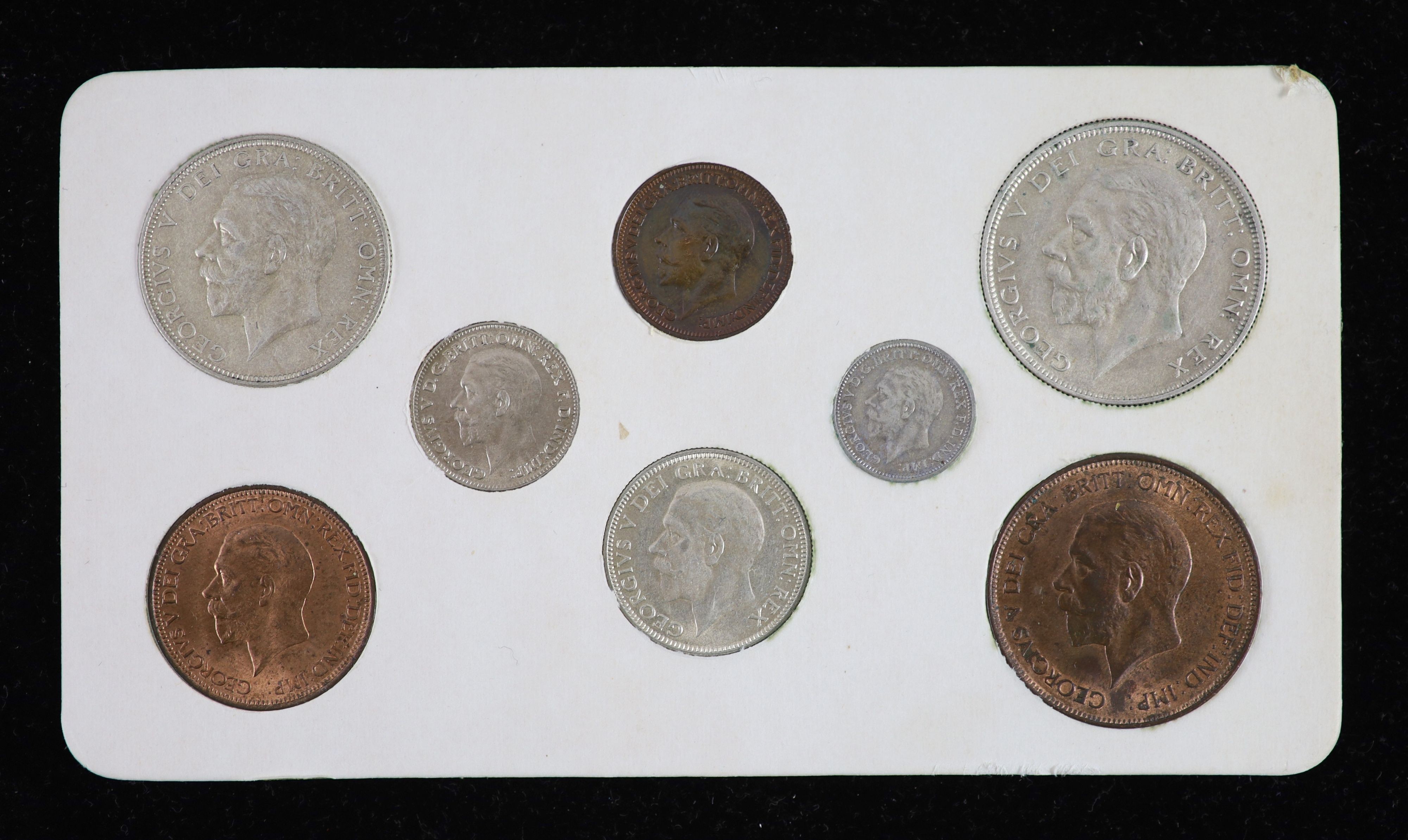 A George V specimen set of eight coins, 1930, fourth coinage, comprising Halfcrown (S4037), cleaned otherwise about EF, florin, shilling, sixpence, cleaned otherwise about EF, threepence, cleaned VF and penny to farthing